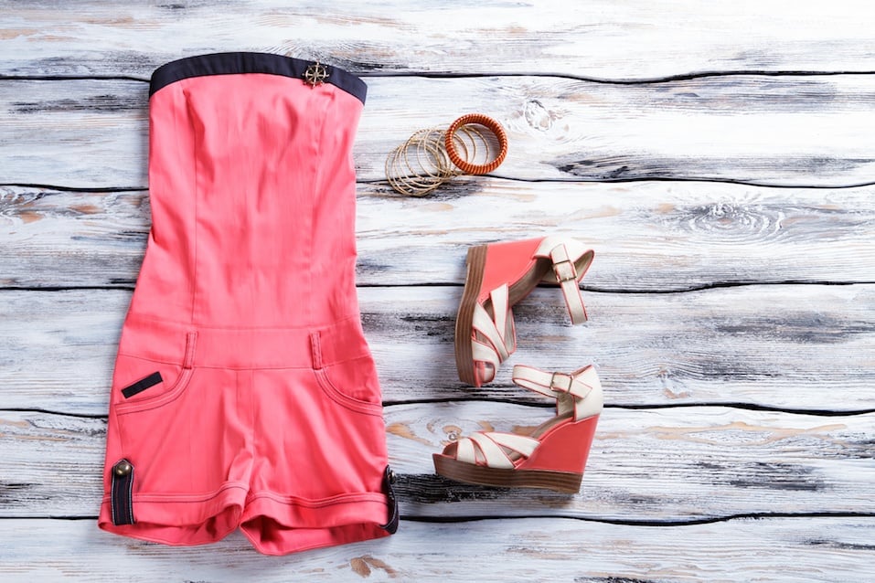 Salmon jumpsuit shorts with footwear. Girl's apparel on showcase. Brightness, style and quality.