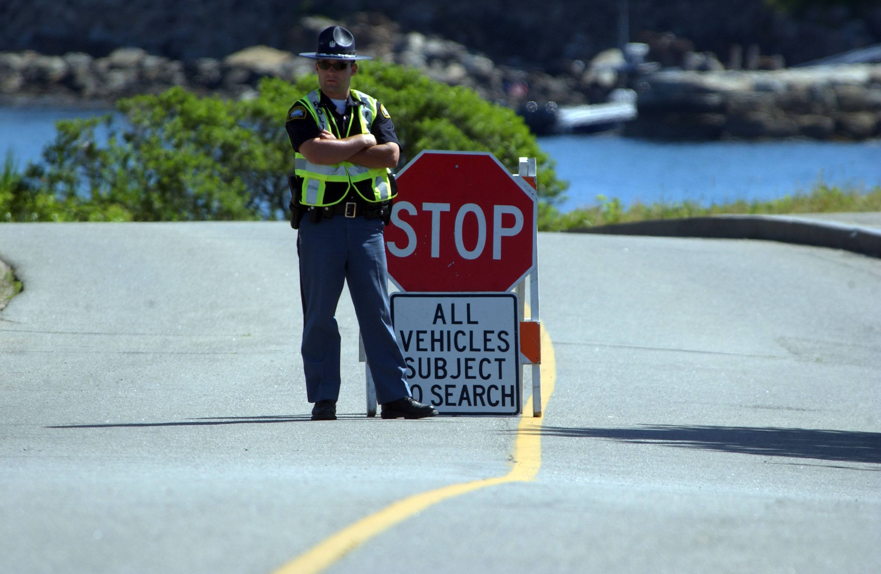 A state police officer mans a checkpoint