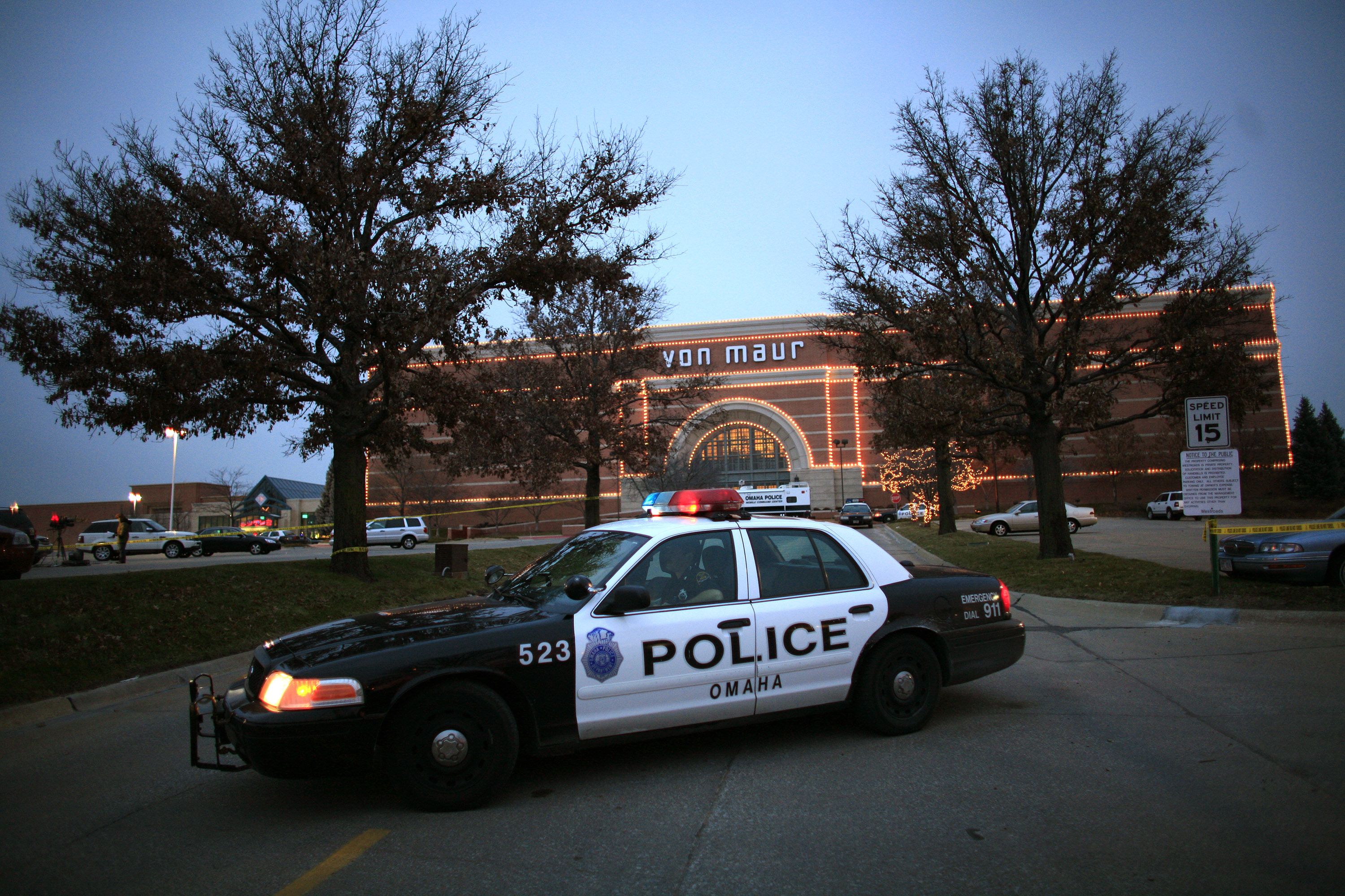 A police car sits in front of the Von Maur store at the Westroads Mall in Omaha, Nebraska