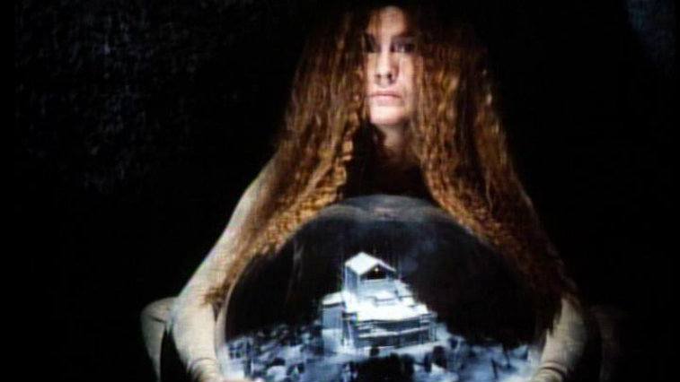 Amelie Syberberg holding a dome with a model city in Parsifal