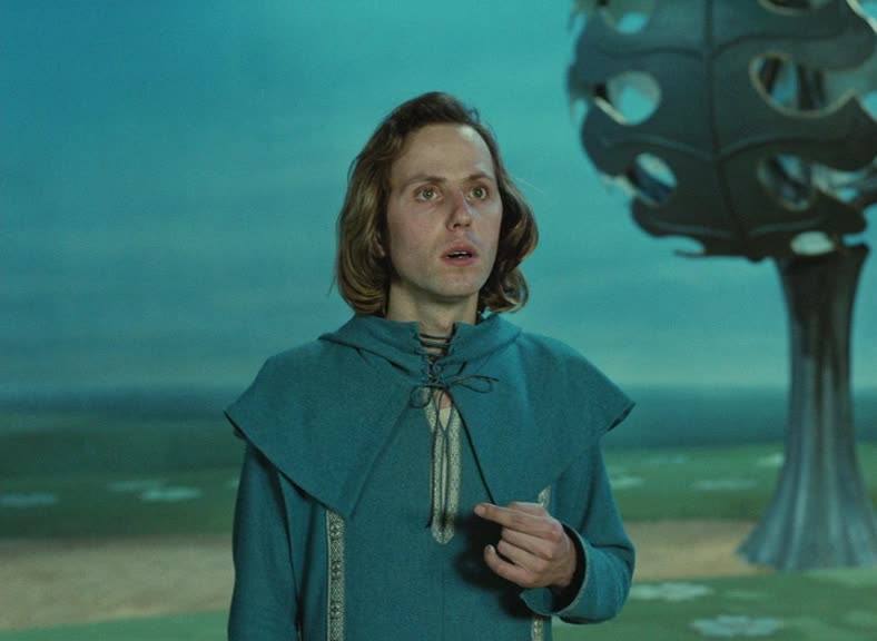 Fabrice Luchini in a robe looking surprised in Perceval le Gallois