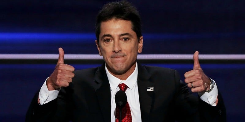 Scott Baio is on stage giving two thumbs up.