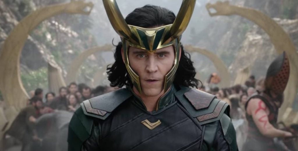 Loki with his horn helmet, looking directly at the camera