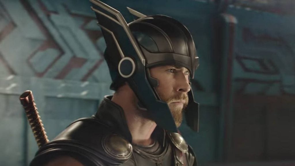 Thor looking to the right of the frame wearing his winged helmet