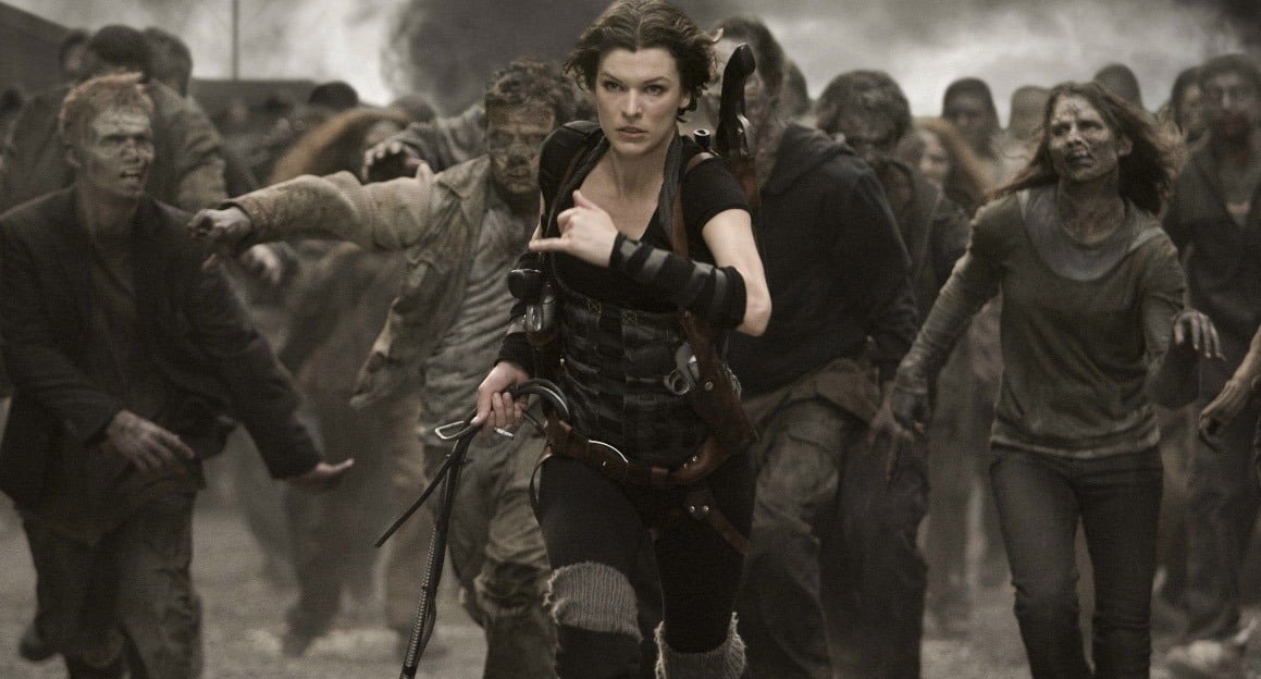 Milla Jovovich runs away from zombies, toward the camera