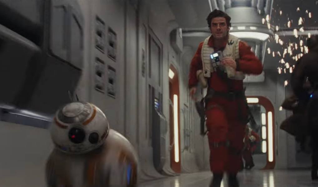 Poe Dameron and BB-8 running through a hallway.