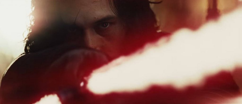 Kylo Ren pointing his red lightsaber