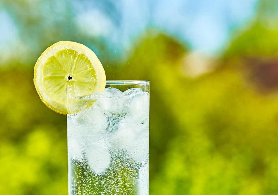 water and lemon slice on glass