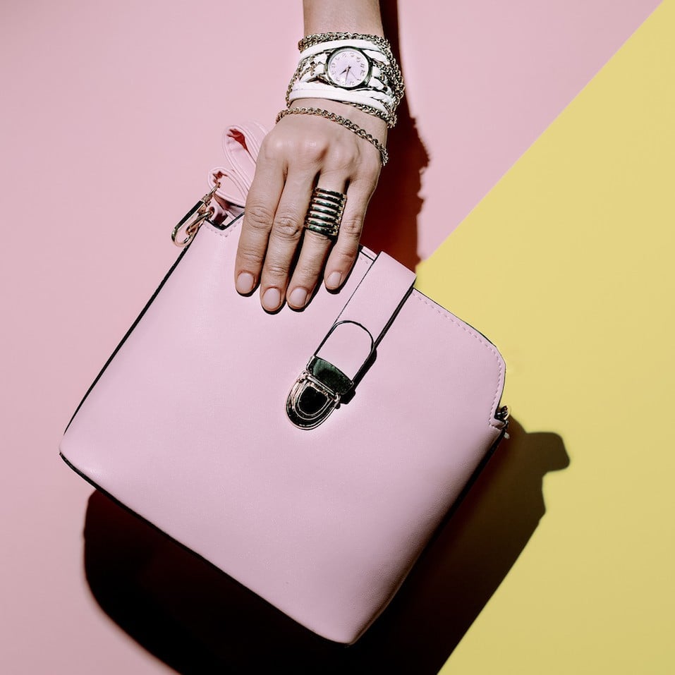 Stylish accessories. Bag and jewelery. Pastel colors trend.