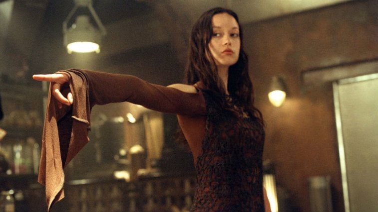 Summer Glau in Serenity standing defiantly looking off-camera with a hand pointed outward in a graceful pose. Summer Glau in Serenity standing defiantly looking off-camera with a hand pointed outward in a graceful pose.