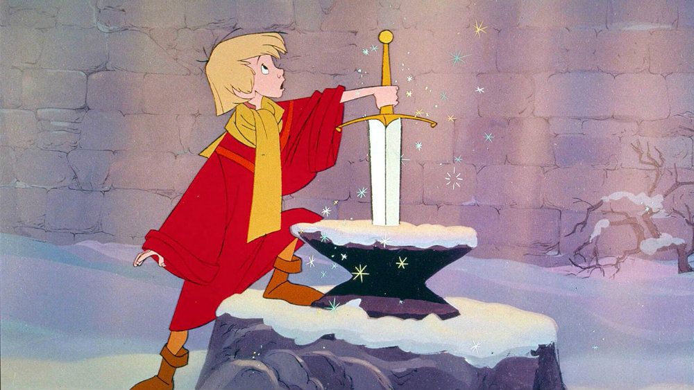 Arthur looking up and with his hand on Excalibur in The Sword in the Stone