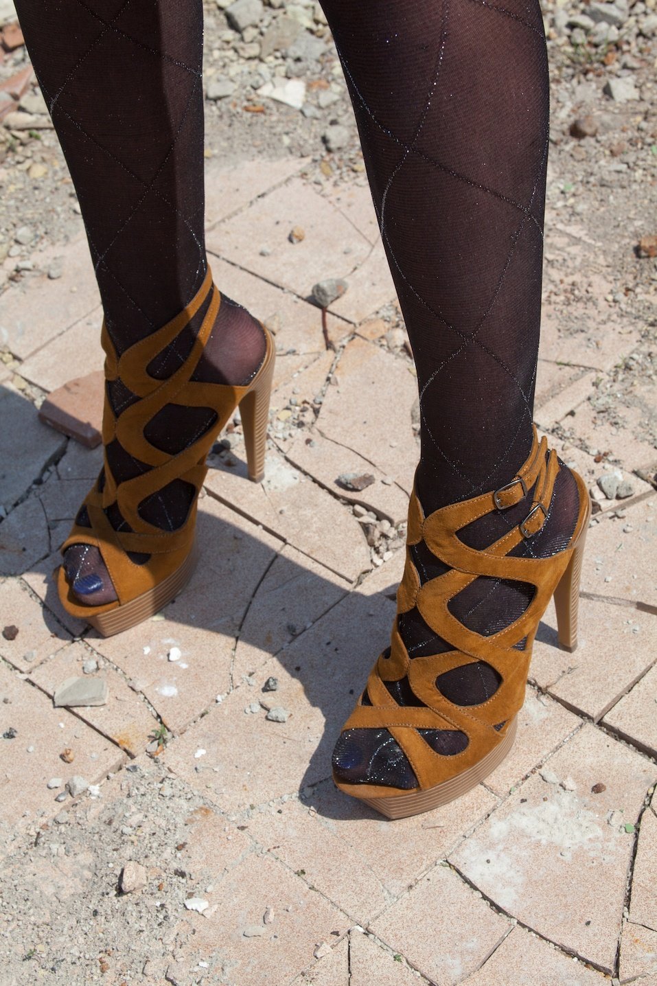 Woman's feet in high heel sandals