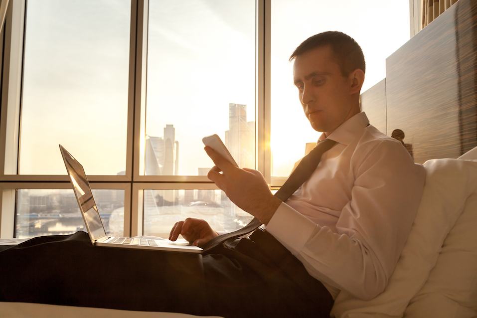 man in 30s looking at phone