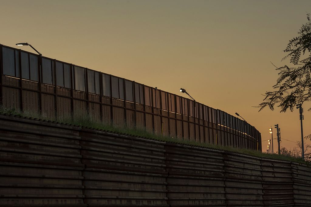 Multiple layers of steel walls, fences, razor wire and other barricades are seen on the US- Mexico border