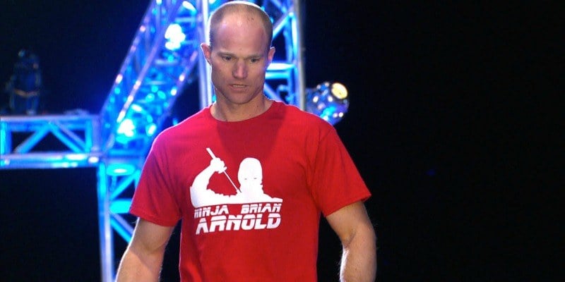 Brian Arnold competing in his red ninja warrior t shirt