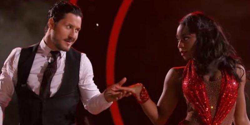 Val reaches for Normani's hand as they are dancing on the show.