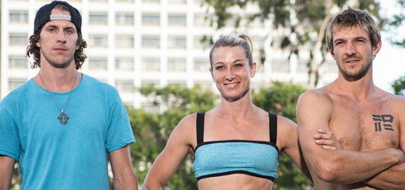 Jessie Graff, Nick Coolridge, and Jesse LaFlair pose together in light blue uniforms.