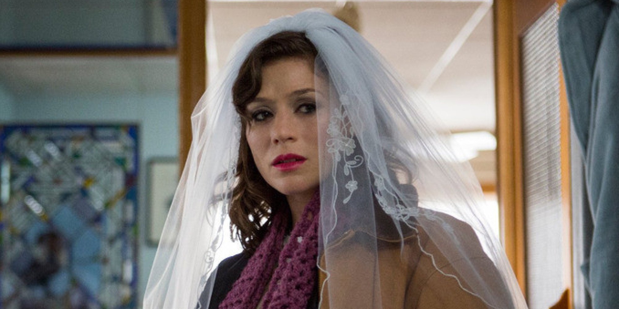 Yael Stone as Lorna Morello looking sad while wearing a wedding veil on Orange Is the New Black