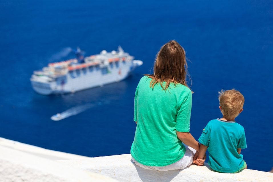 Mother and son looking at Santorini, Greece