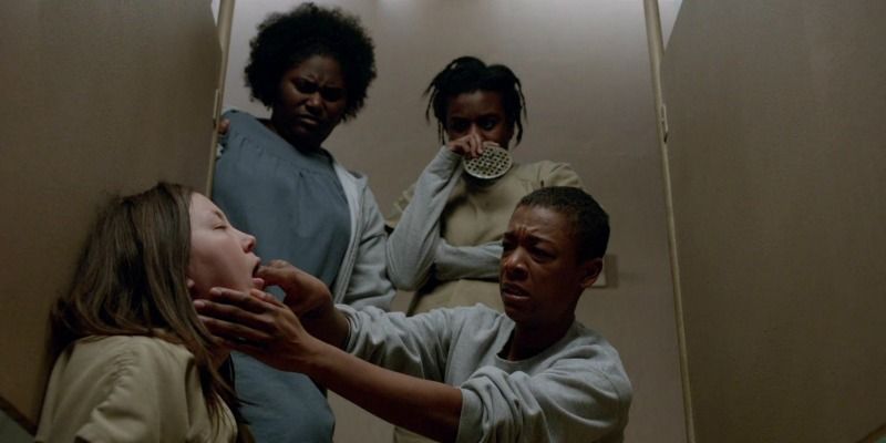 Poussey sticks her finger in Soso's mouth to get her to throw up.