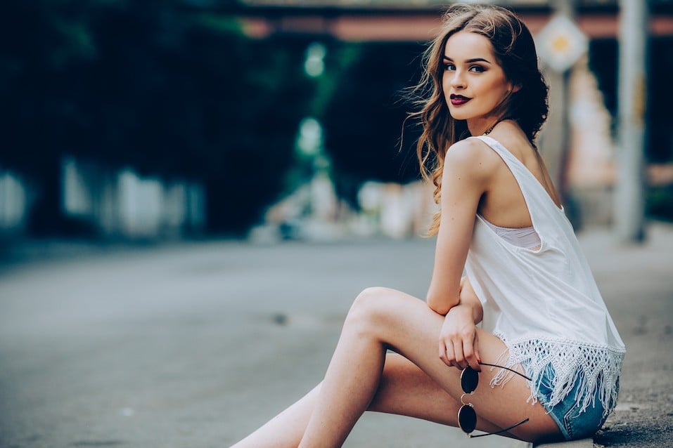 beautiful girl posing in the city on the street