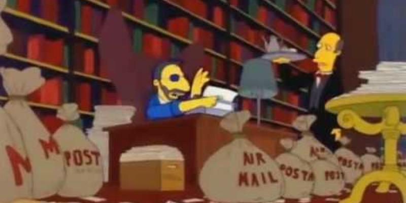 Ringo Starr is sitting at a desk writing on a typewriter and is surrounded by bags of fan mail on The Simpsons.