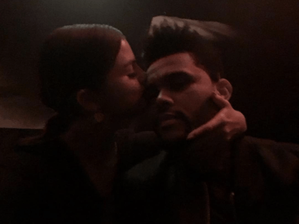 Selena Gomez embraces The Weeknd and kisses him on the temple in an image posted to his Instagram account on April 8, 2017.