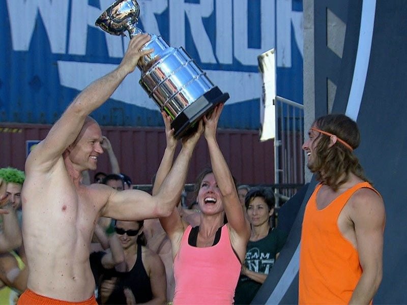 Team Party Time are holding up the trophy after their win on Team Ninja Warrior.
