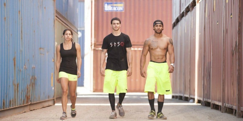 Team Ronin is walking to the camera in black and yellow uniforms.