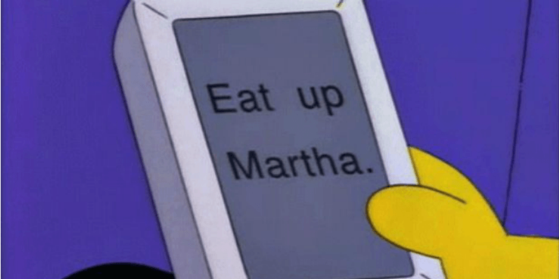 Homer is holding the Newton device that has the words "Eat up Martha" on it.