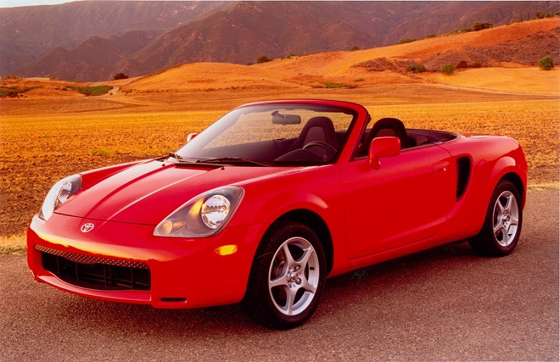 Red Toyota MR2 Spyder in country setting
