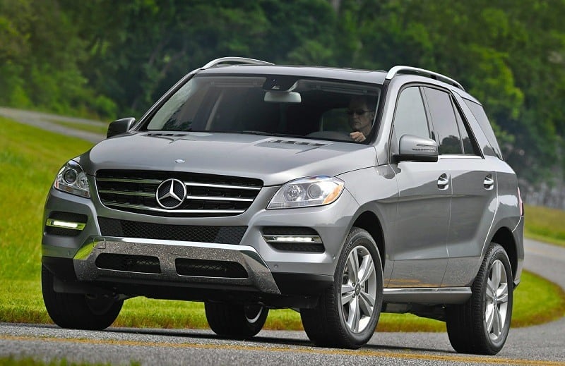 OEM shot of 2014 Mercedes M-Class SUV on country road