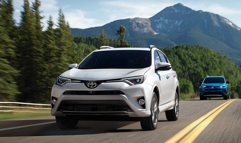 White RAV4 followed by blue RAV4 hybrid