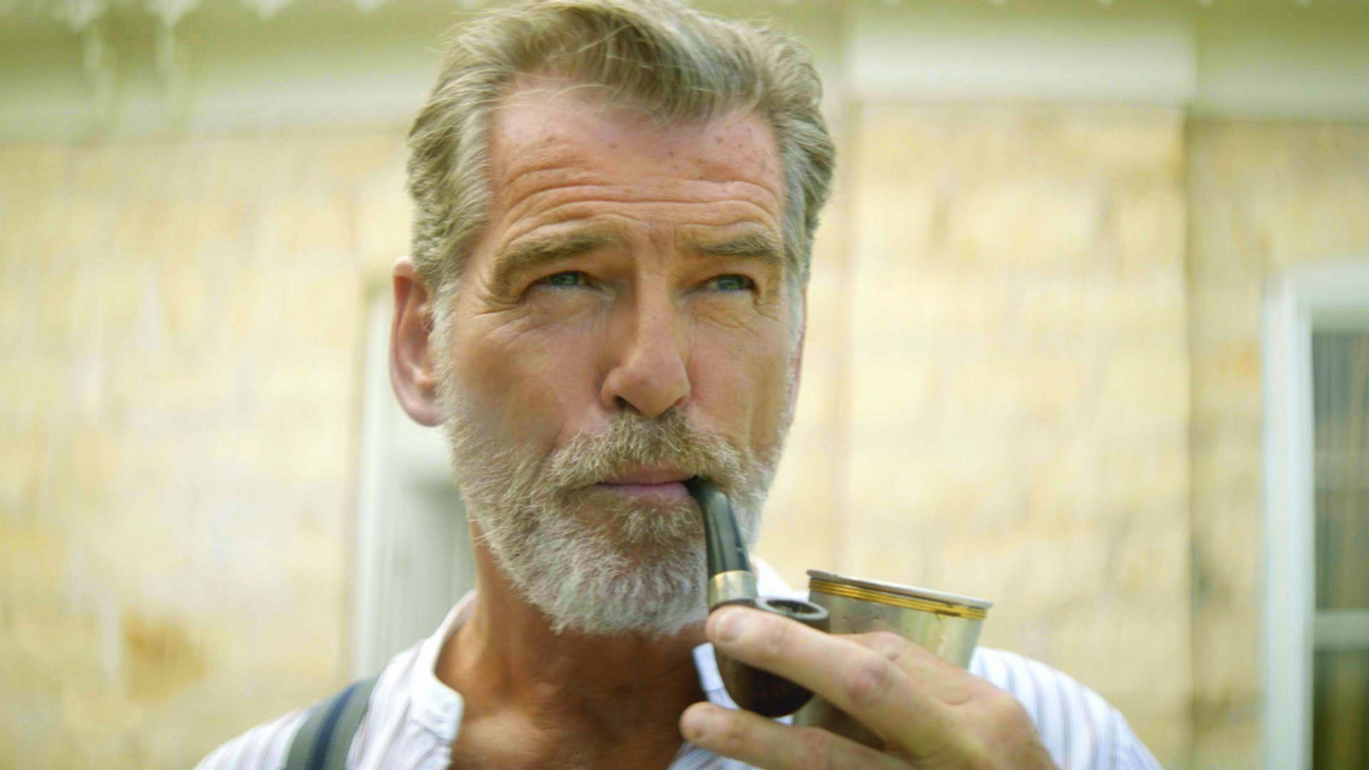 Pierce Brosnan smokes a pipe in The Son