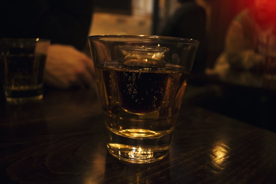 two glass cocktail, in low light inside a pub background