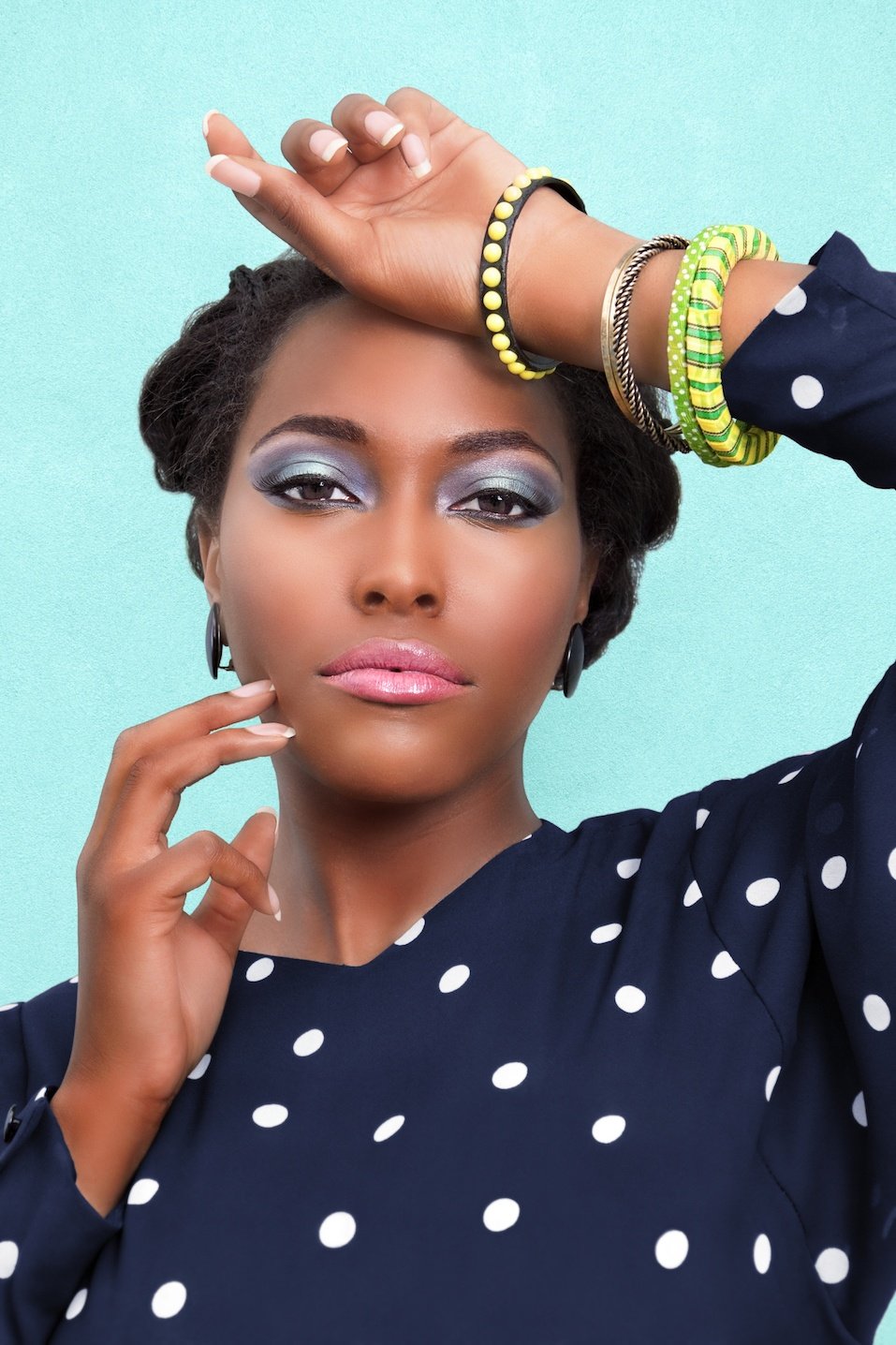 African American woman wearing pink lipstick makeup and jewelry