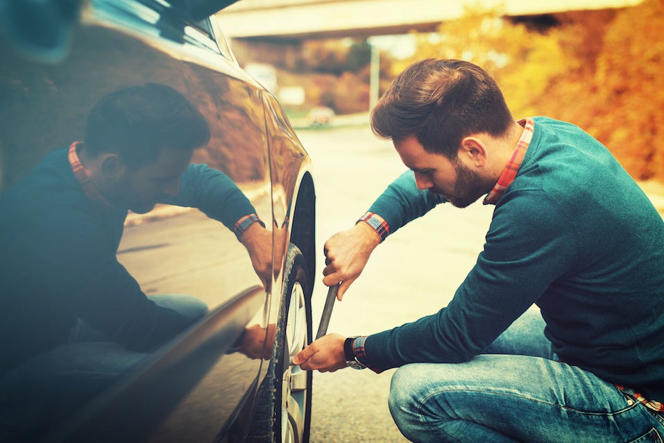 man fixing tire