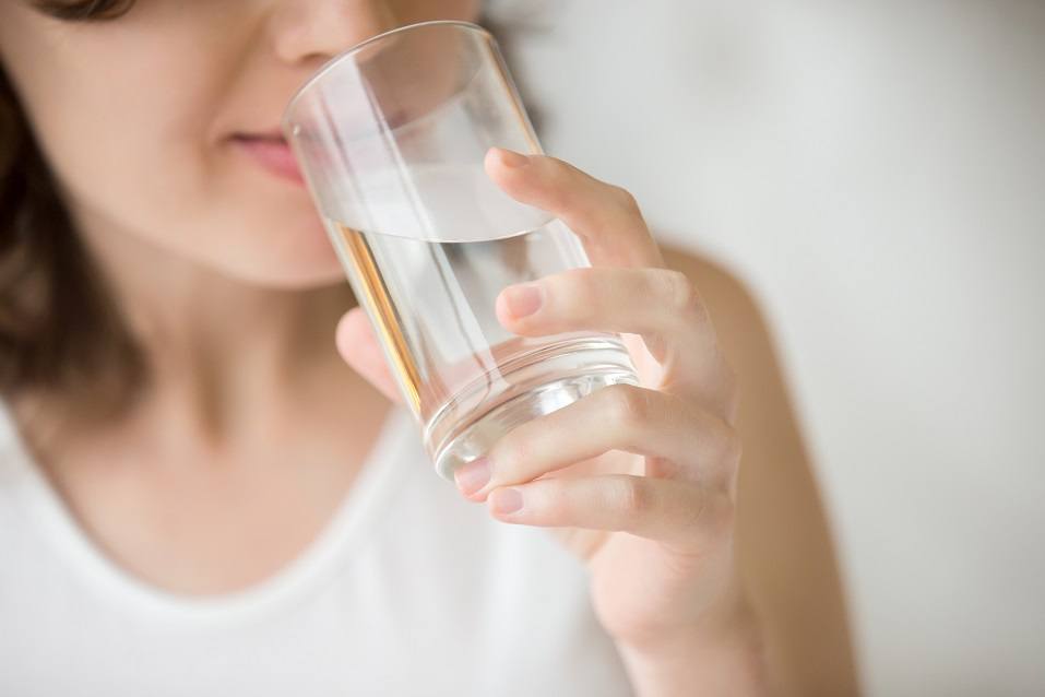 young woman drinking water