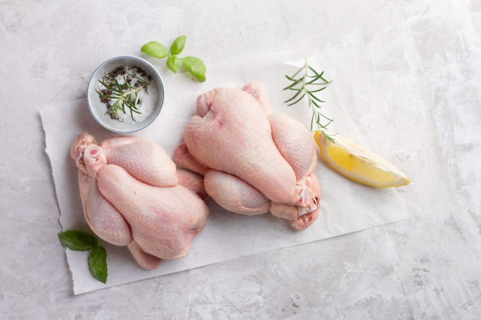 Fresh chicken with spices on vintage background