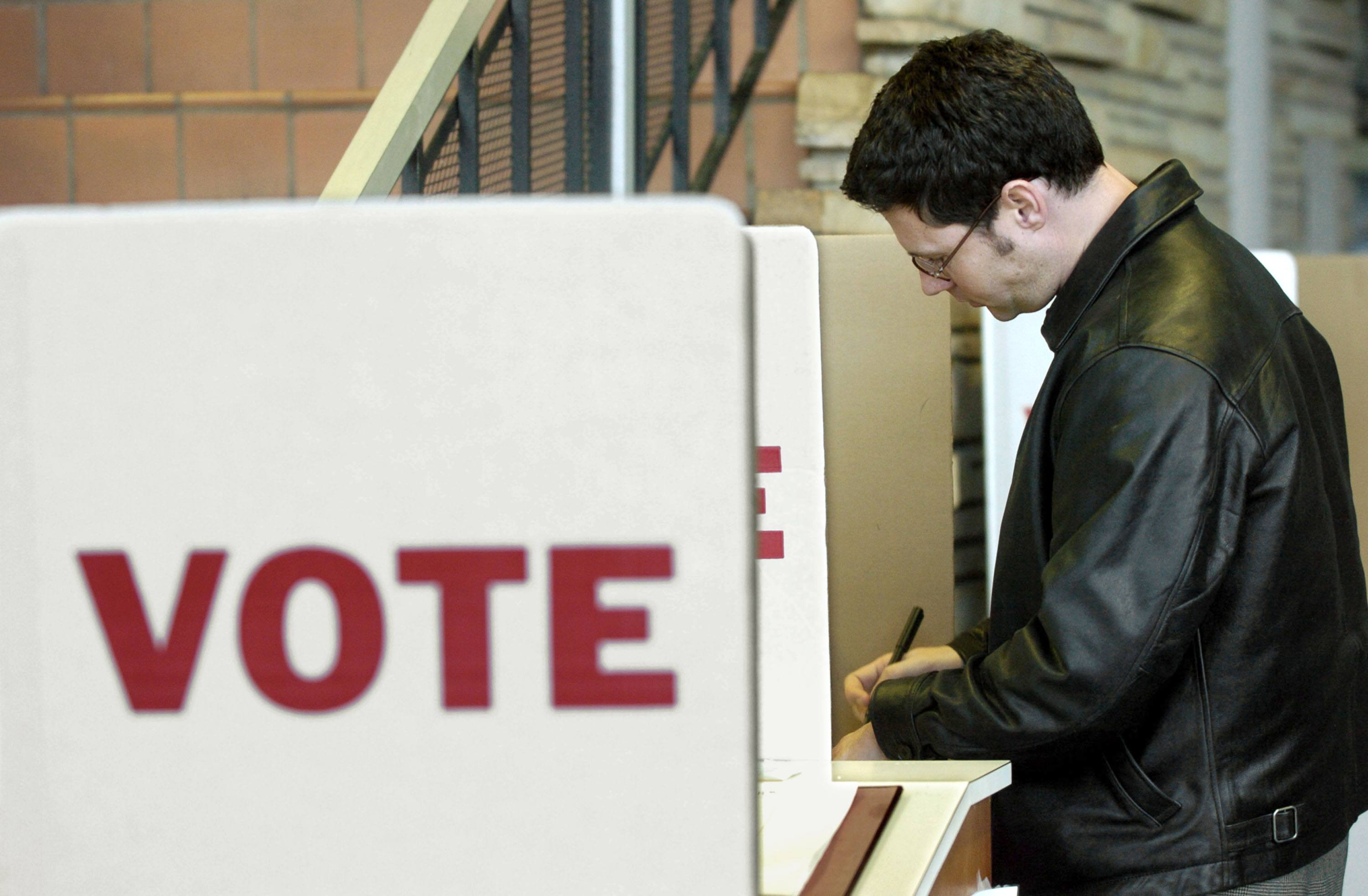 An Oklahoma voter fills out a ballot
