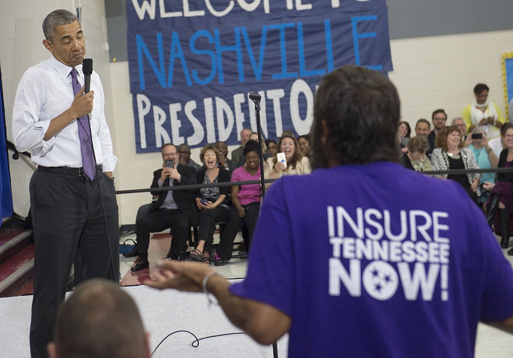 Then President Barack Obama reacts to a question from a man about the Affordable Care Act.