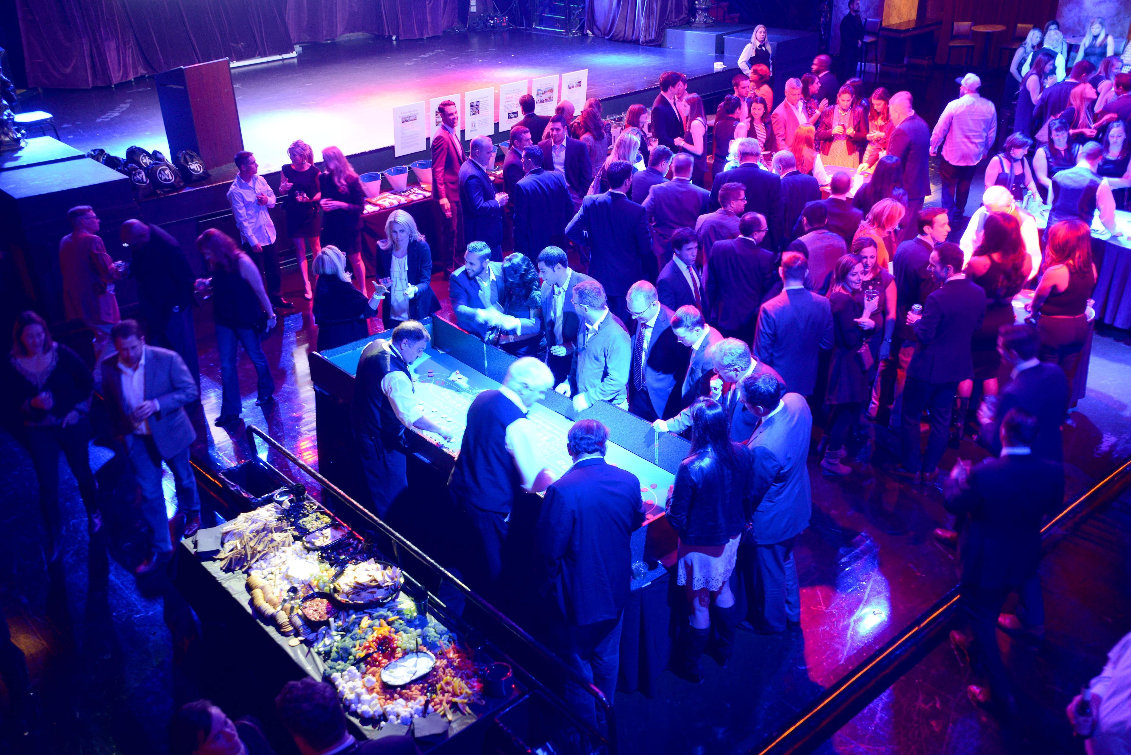 People attend a casino night fundraiser to "Tackle Sickle Cell" benefiting Boston Children's Hospital