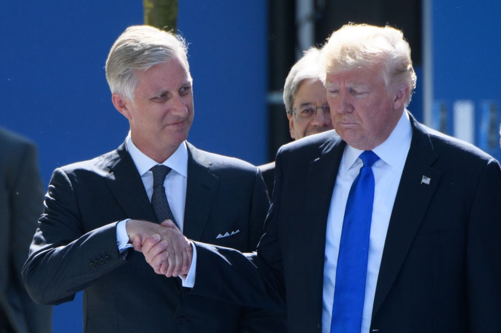 .Belgium's King Philip shakes hands with US President Donald Trump, seeing firsthand the president's affinity for power moves and strategic body language.