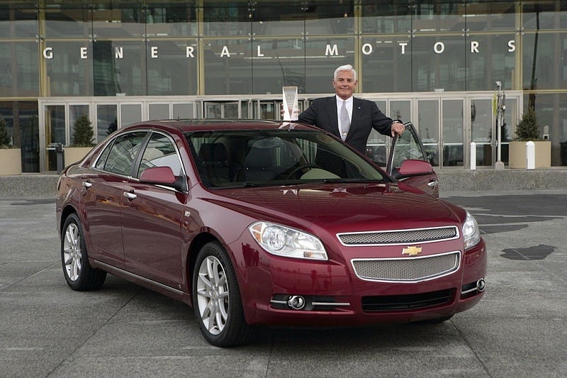 GM's Bob Lutz poses with Chevrolet Malibu, 2008 North American Car of the Year