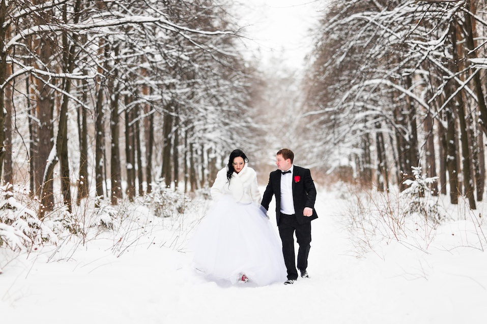 Happy bride and groom in winter wedding day.