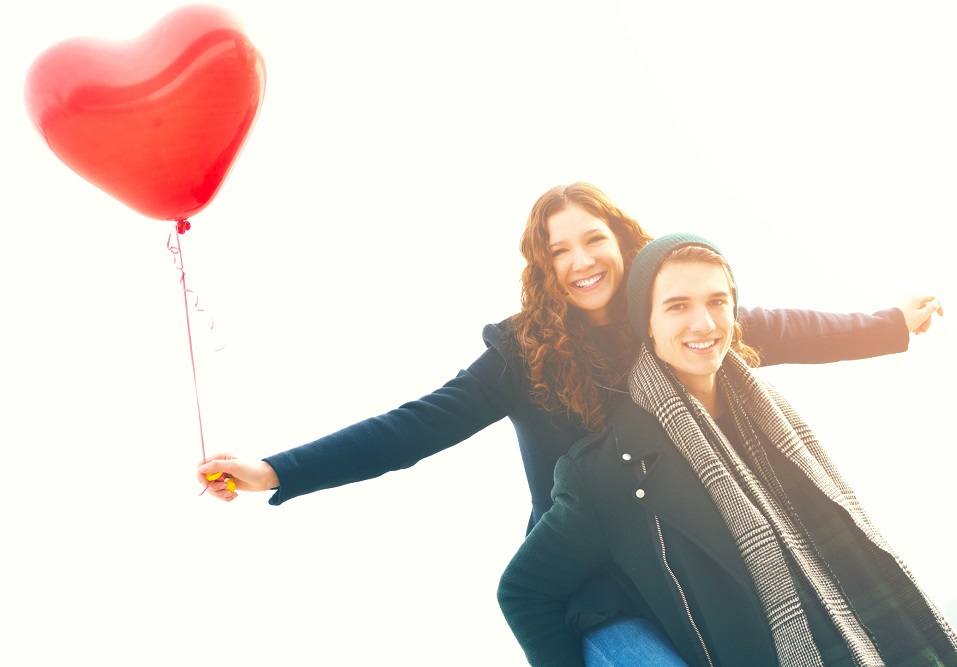 young man piggybacking his girlfriend