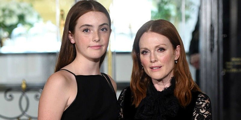 Liv Freundlich and Julianne Moore pose together in black dresses.