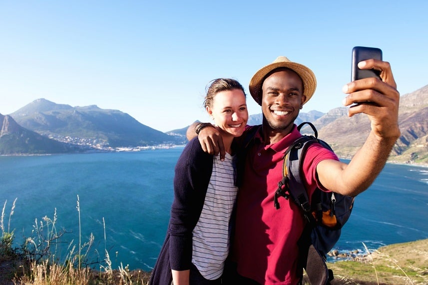 young couple on holiday taking selfie