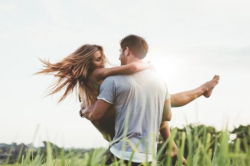 young man carrying his girlfriend