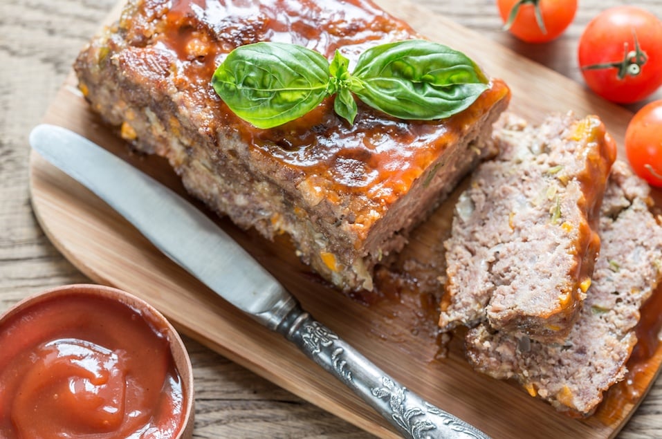 Meat loaf with barbecue sauce on the wooden board